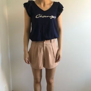 Navy blue top and beige trouser shorts